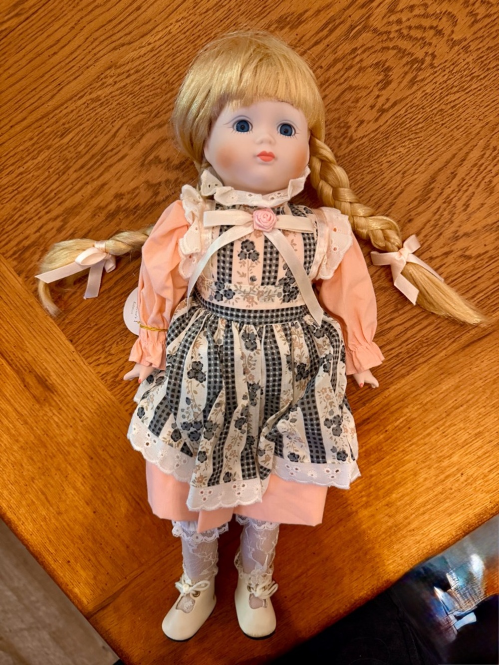 Vintage Porcelain Doll in Pink Dress with Floral Apron